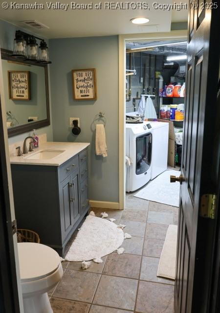 282 Dupont Rd, Poca, WV 25159 - bathroom featuring independent washer and dryer and vanity