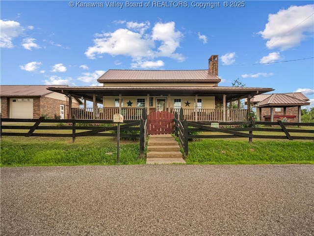 4728 Cain Ridge Rd, Leon, WV 25123 - country-style home with a chimney and a metal roof