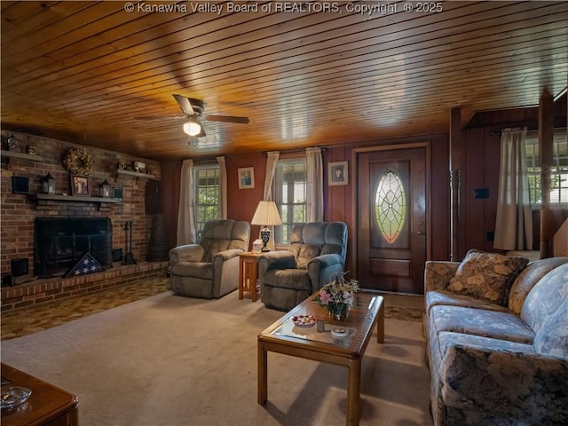 4728 Cain Ridge Rd, Leon, WV 25123 - living room featuring wooden ceiling, ceiling fan, a fireplace, and carpet flooring