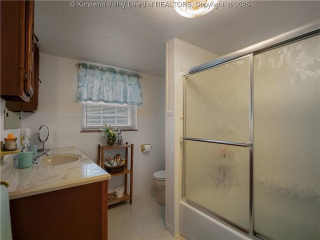 4728 Cain Ridge Rd, Leon, WV 25123 - bathroom featuring vanity, a textured ceiling, shower / bath combination with glass door, and wainscoting