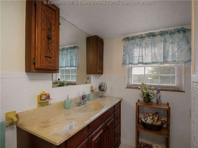4728 Cain Ridge Rd, Leon, WV 25123 - bathroom featuring a textured ceiling, vanity, and tasteful backsplash