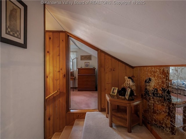 4728 Cain Ridge Rd, Leon, WV 25123 - hallway with lofted ceiling, wooden walls, plenty of natural light, and carpet