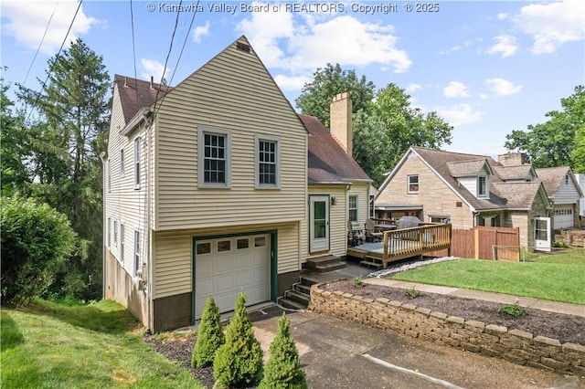 2526 Spring St, South Charleston, WV 25303 - view of front of property featuring a garage, a chimney, driveway, and a deck