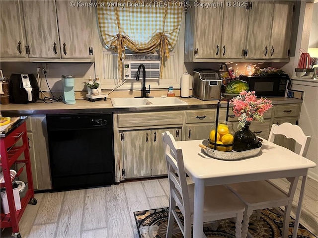 123 Valley Dr, Nitro, WV 25143 - kitchen featuring black appliances, light wood-type flooring, and light countertops