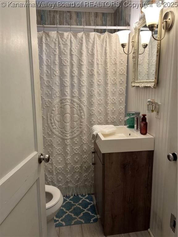 123 Valley Dr, Nitro, WV 25143 - full bathroom featuring vanity, a shower with curtain, and wallpapered walls