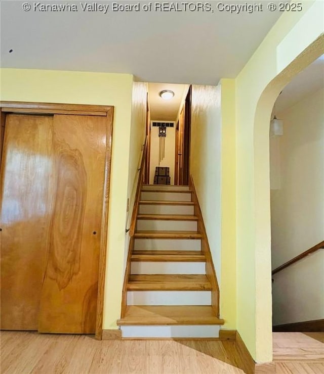 1816 Winding Hill Dr, Sissonville, WV 25320 - stairs with arched walkways and wood finished floors