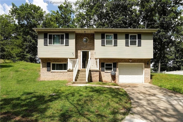 51 Beaver Dr, Hurricane, WV 25526 - split foyer home with brick siding, driveway, an attached garage, and a front lawn