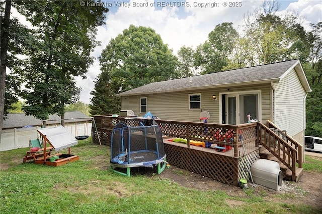 51 Beaver Dr, Hurricane, WV 25526 - rear view of house featuring a wooden deck, a trampoline, and a shingled roof