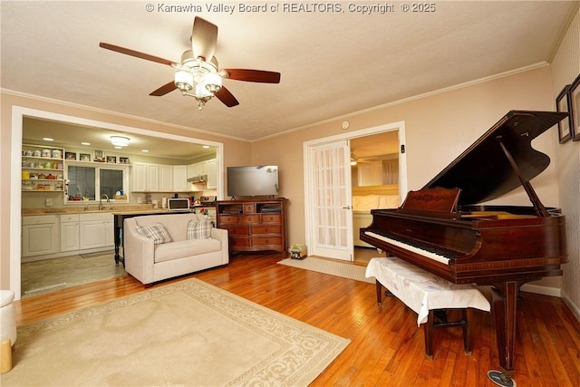 1009 Midway Dr, Dunbar, WV 25064 - living area with light wood-type flooring, ornamental molding, and a ceiling fan