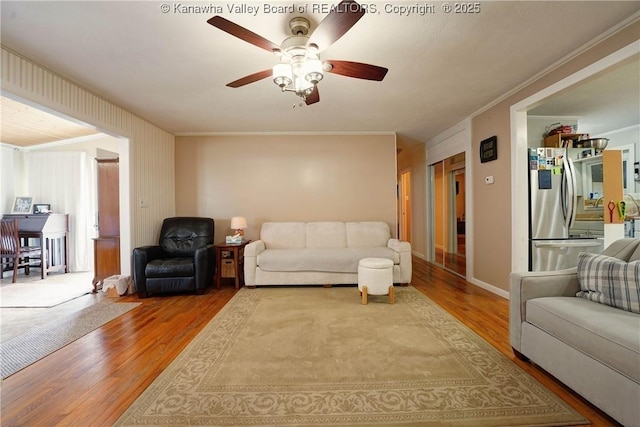 1009 Midway Dr, Dunbar, WV 25064 - living area featuring wood finished floors, crown molding, and ceiling fan