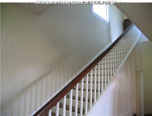 stairway with a high ceiling