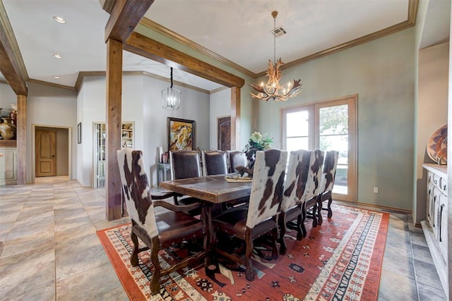 dining area with crown molding and a chandelier