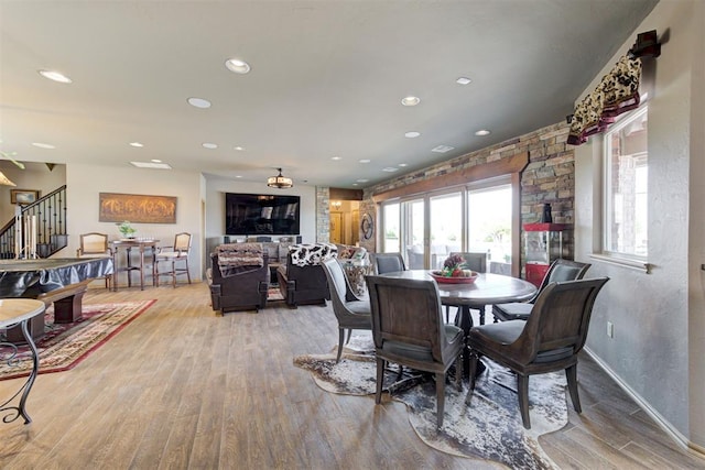 dining space featuring light hardwood / wood-style flooring and billiards