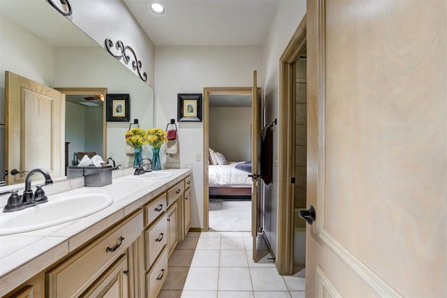 bathroom featuring tile patterned flooring and vanity