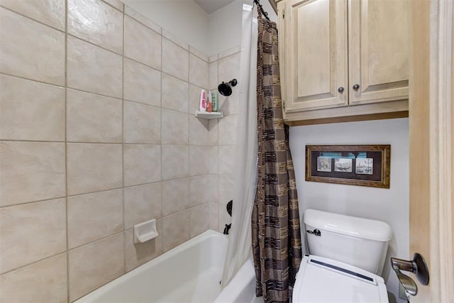 bathroom with shower / tub combo and toilet