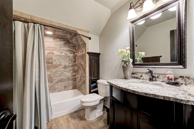 full bathroom featuring vanity, vaulted ceiling, hardwood / wood-style flooring, toilet, and shower / tub combo