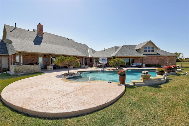 view of pool with a lawn and a patio area