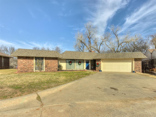 single story home with a front yard and a garage