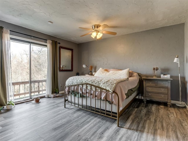 bedroom featuring hardwood / wood-style flooring and ceiling fan