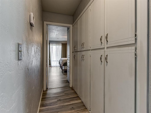 corridor featuring hardwood / wood-style floors