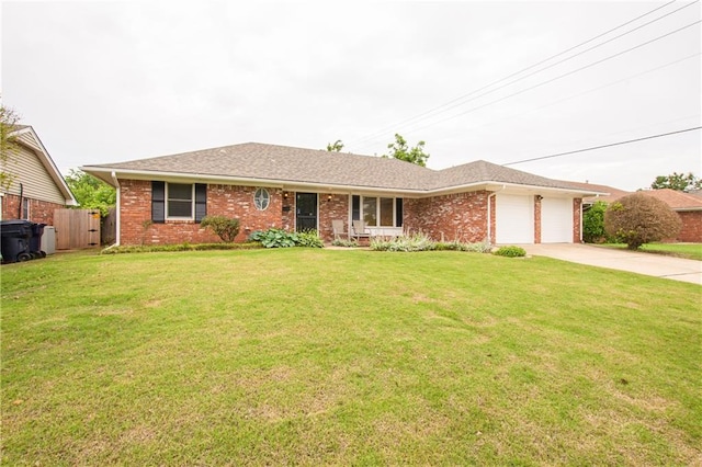 ranch-style home with a front yard and a garage