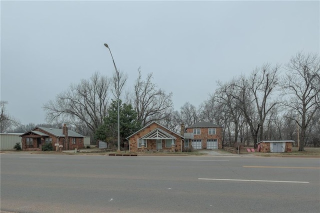 1315 S Division St, Guthrie, OK 73044 - view of asphalt road with street lighting