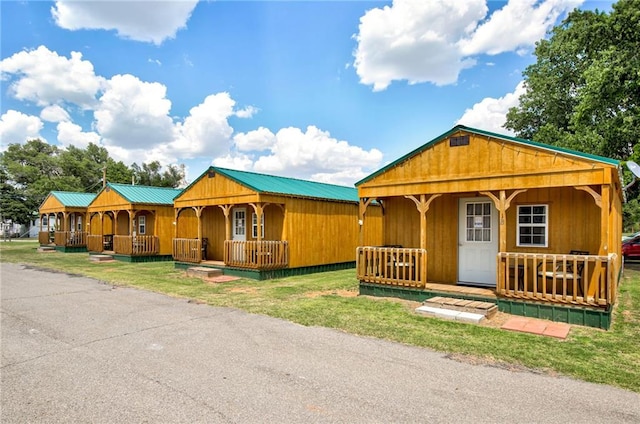304 W Oak St, Canton, OK 73724 - view of front of home featuring a porch and metal roof