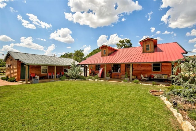 rear view of house featuring a patio area, an outdoor living space, and a yard