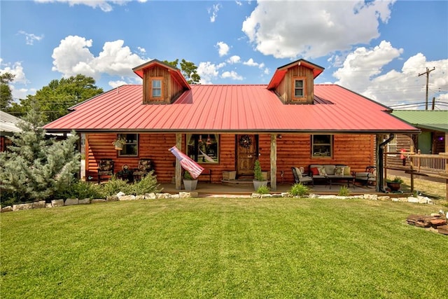 view of front of home with an outdoor hangout area and a front lawn