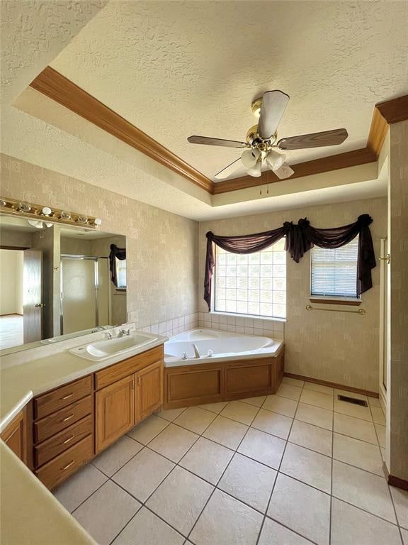 bathroom featuring tile patterned floors, crown molding, and a textured ceiling