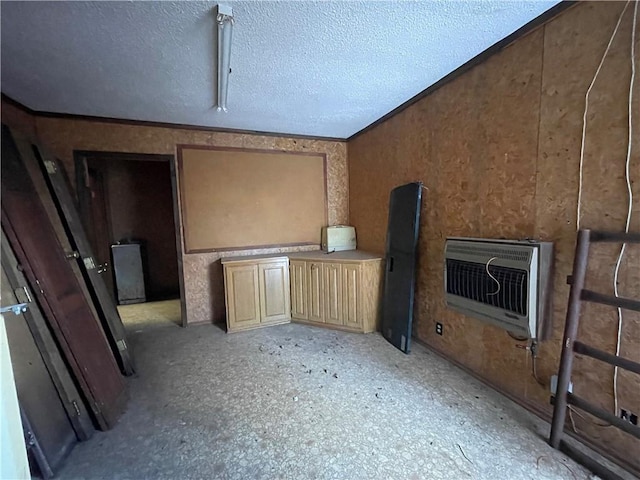 unfurnished living room with lofted ceiling, a textured ceiling, and heating unit