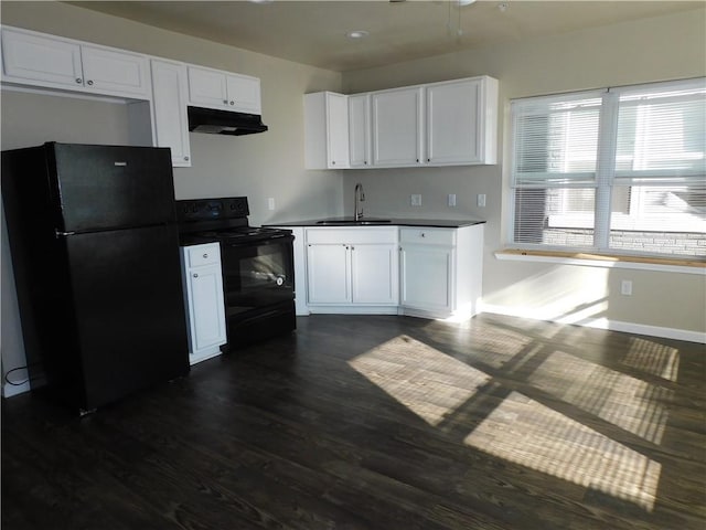 kitchen featuring dark wood-type flooring, sink, white cabinets, and black appliances