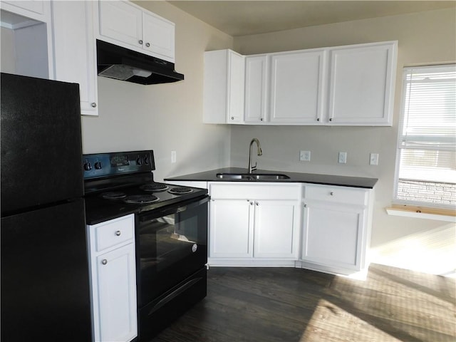 kitchen with dark hardwood / wood-style flooring, white cabinetry, sink, and black appliances