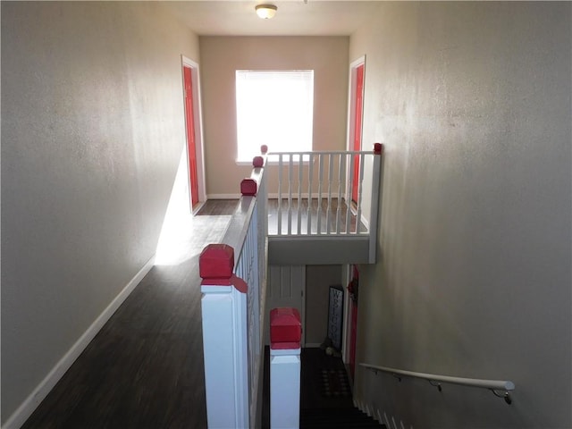 stairs featuring hardwood / wood-style flooring