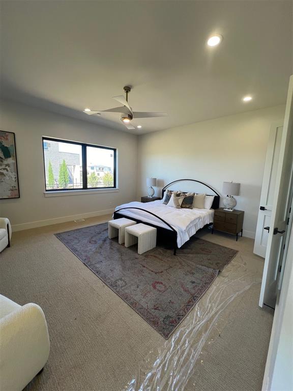 carpeted bedroom featuring ceiling fan