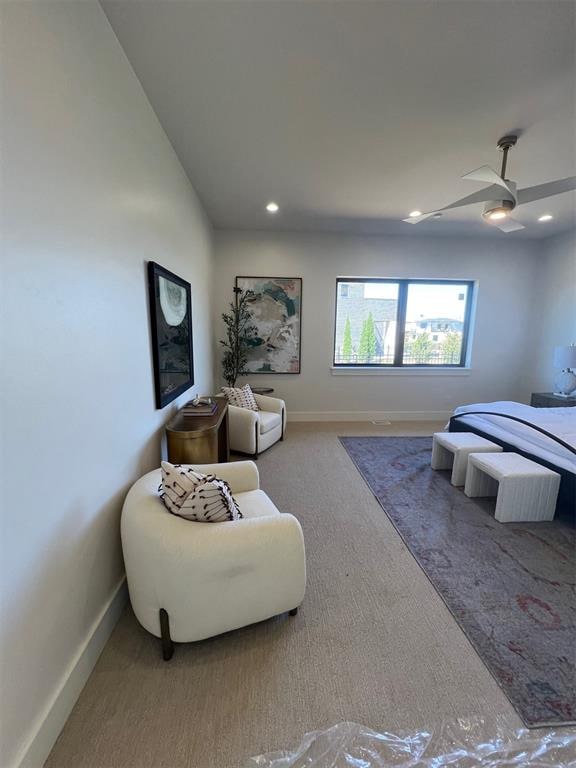 carpeted bedroom featuring ceiling fan