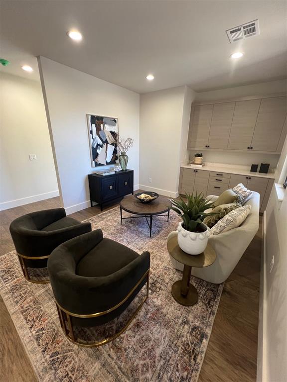 living room with dark hardwood / wood-style flooring