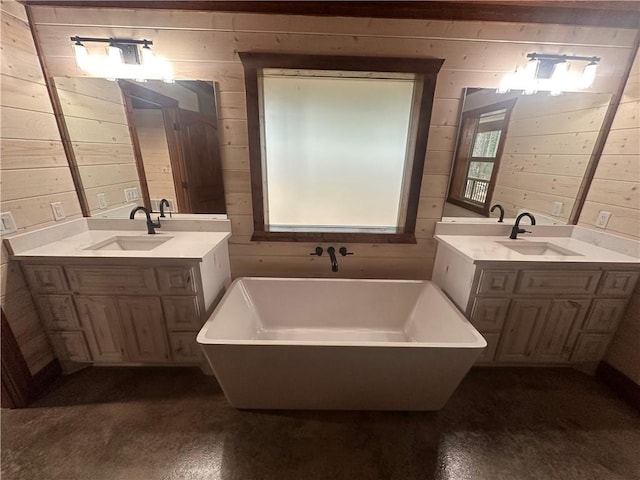 bathroom featuring wooden walls, a bathtub, and vanity