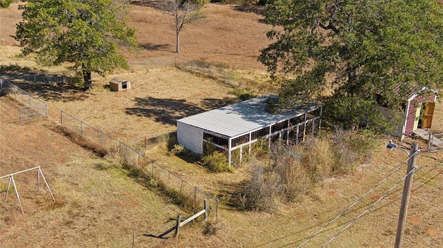 birds eye view of property with a rural view