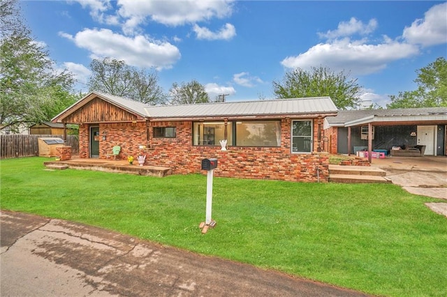 ranch-style house with a front yard and a carport