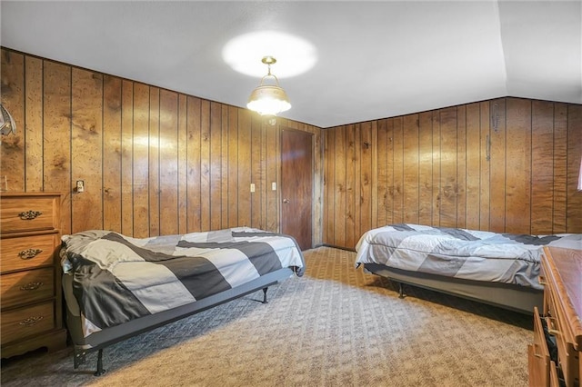 bedroom featuring wood walls, light carpet, and vaulted ceiling