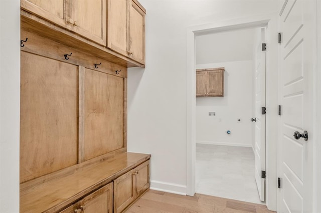 mudroom with light hardwood / wood-style flooring