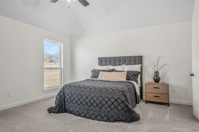 bedroom with ceiling fan and light carpet