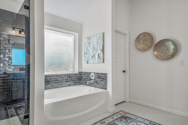 bathroom featuring tile patterned floors, separate shower and tub, and lofted ceiling