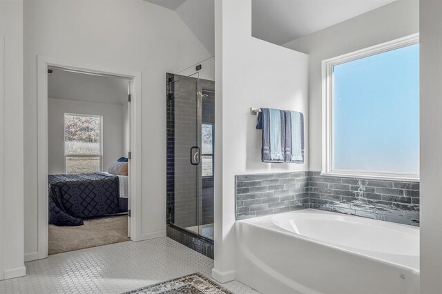 bathroom with tile patterned flooring and plus walk in shower