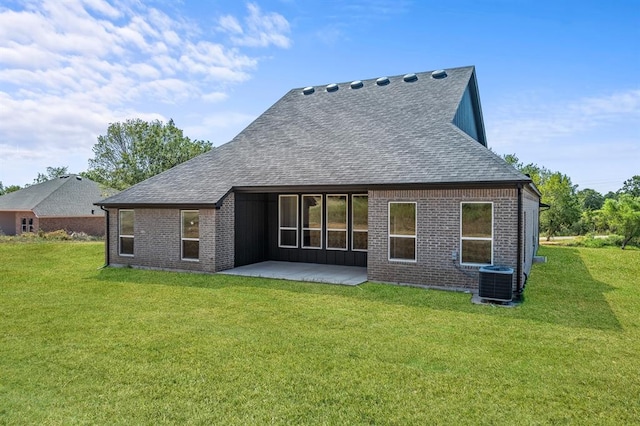 back of property featuring a yard, a patio, and central AC