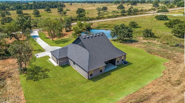 drone / aerial view with a water view and a rural view