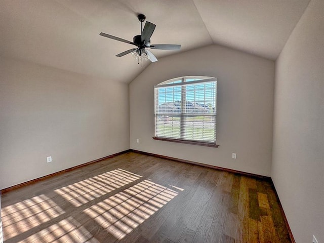 unfurnished room featuring hardwood / wood-style flooring, ceiling fan, and lofted ceiling