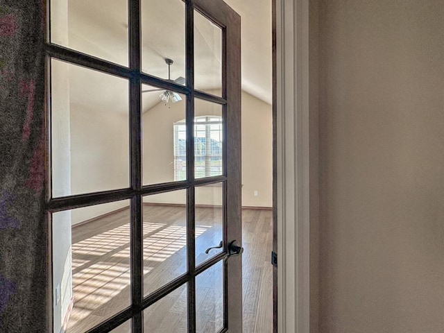 room details with hardwood / wood-style flooring and french doors