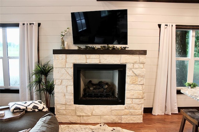 room details with a fireplace and wood-type flooring